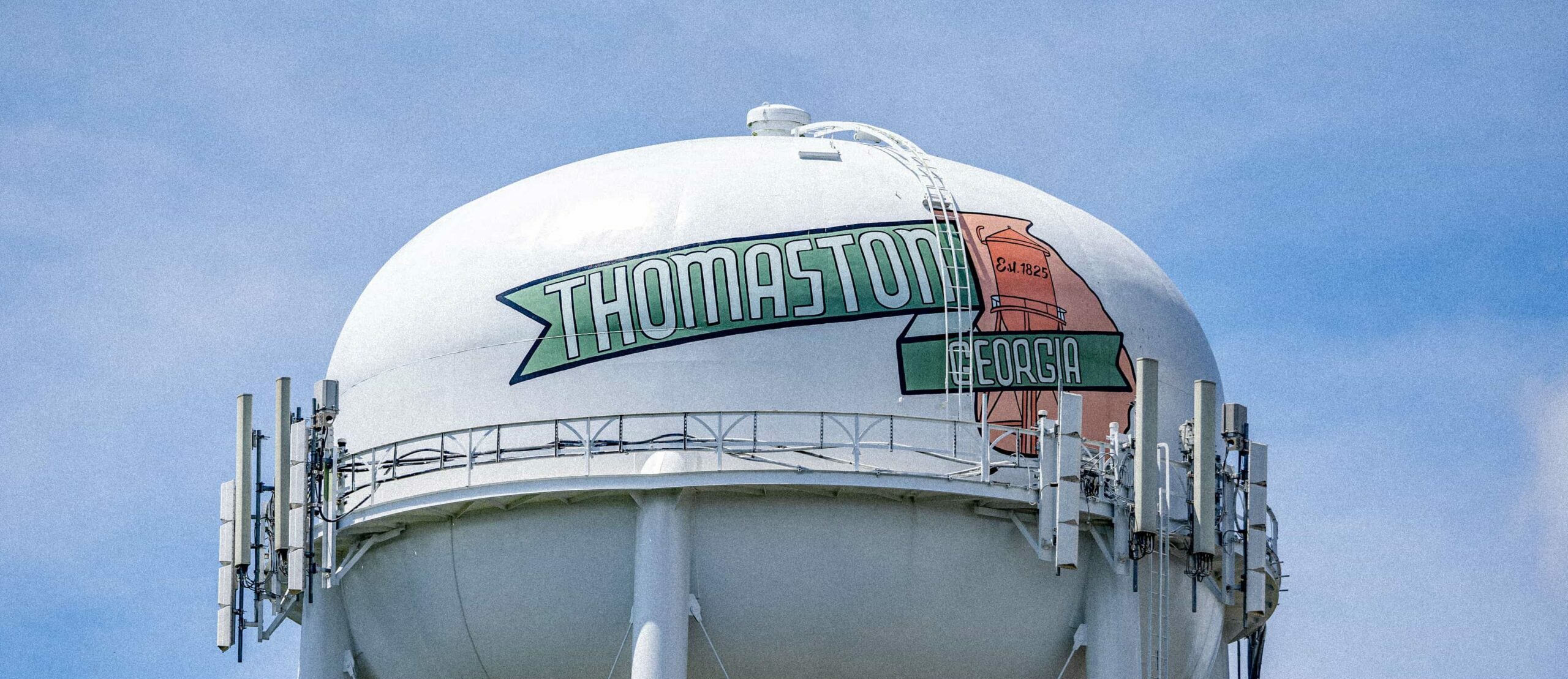 Thomaston, Georgia water tower in front of blue sky