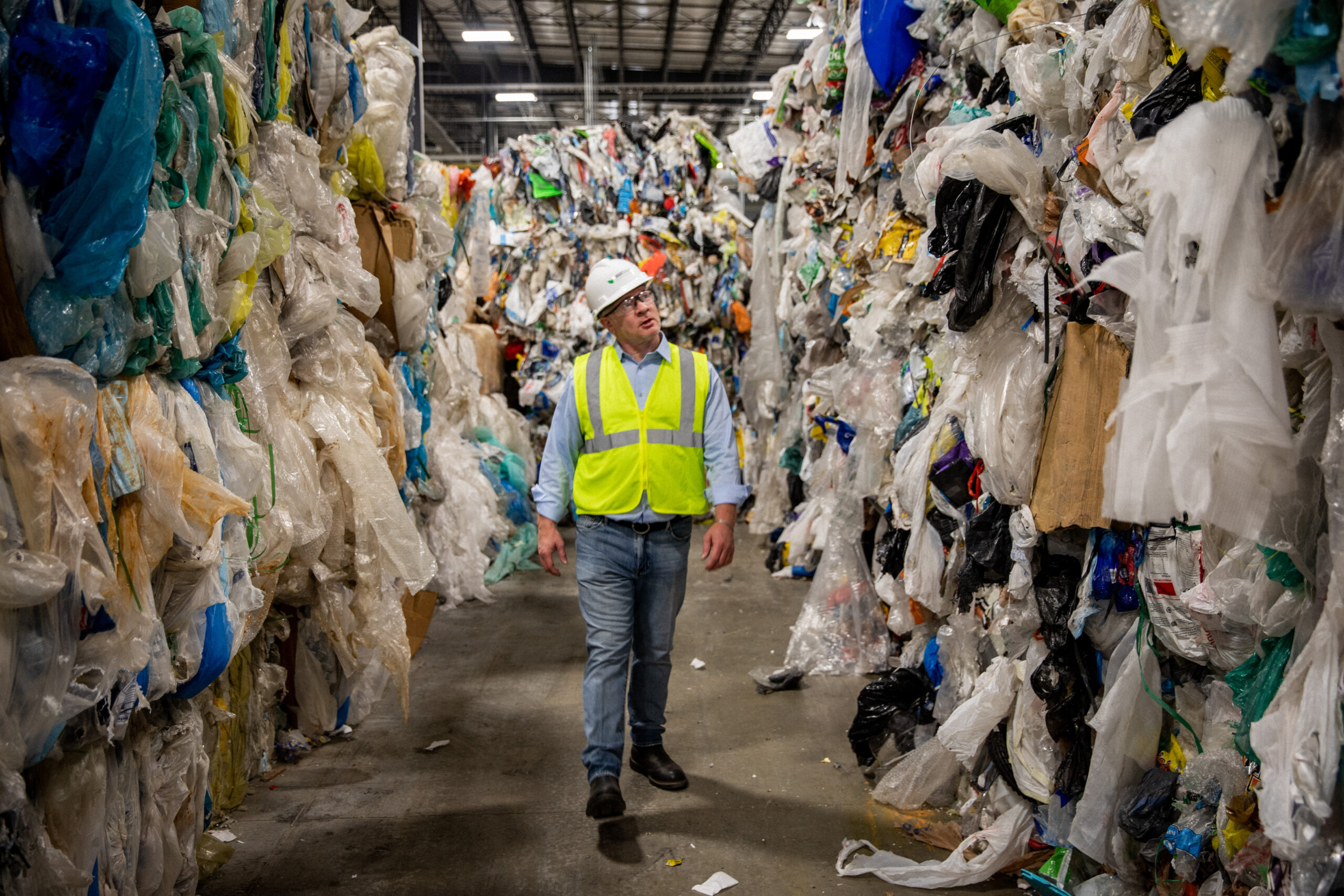 Bob Powell walking inside plastics renewal facility